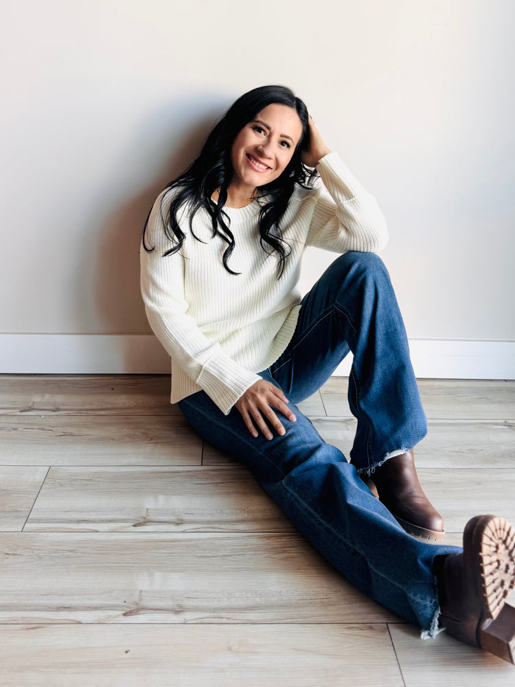 Front view of ivory raglan sleeve sweater with ribbed knit and relaxed fit