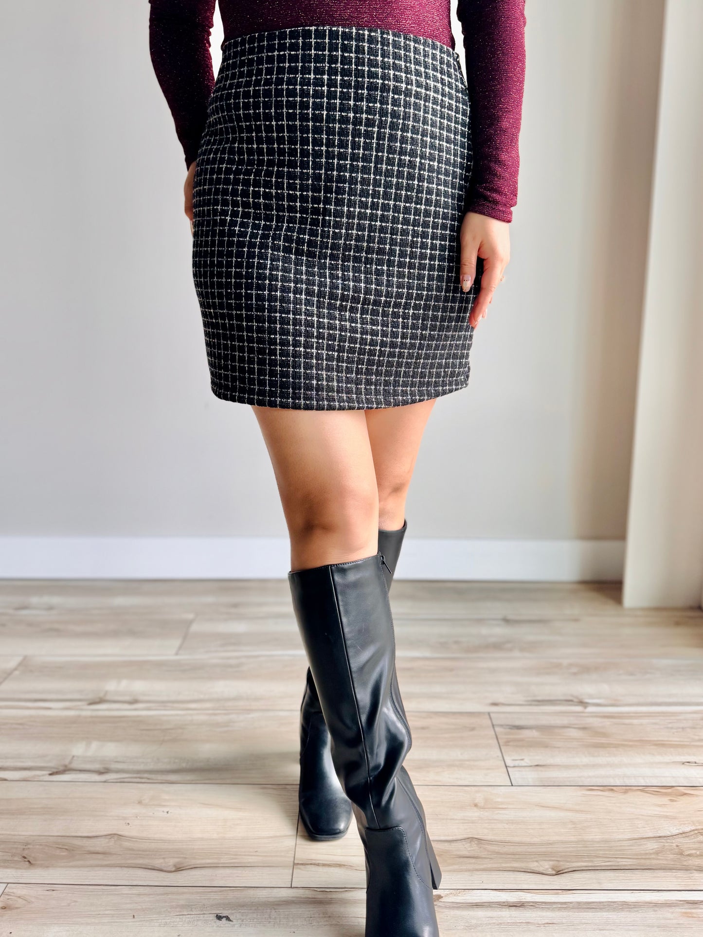 Front view of Ellie tweed mini skirt with structured fit and textured fabric