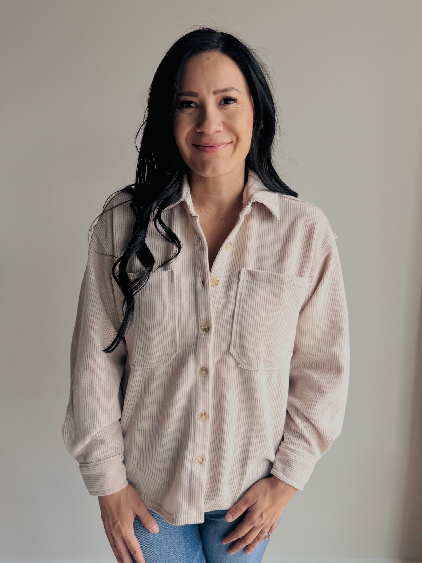 Woman wearing ivory ribbed button-up top Devan
