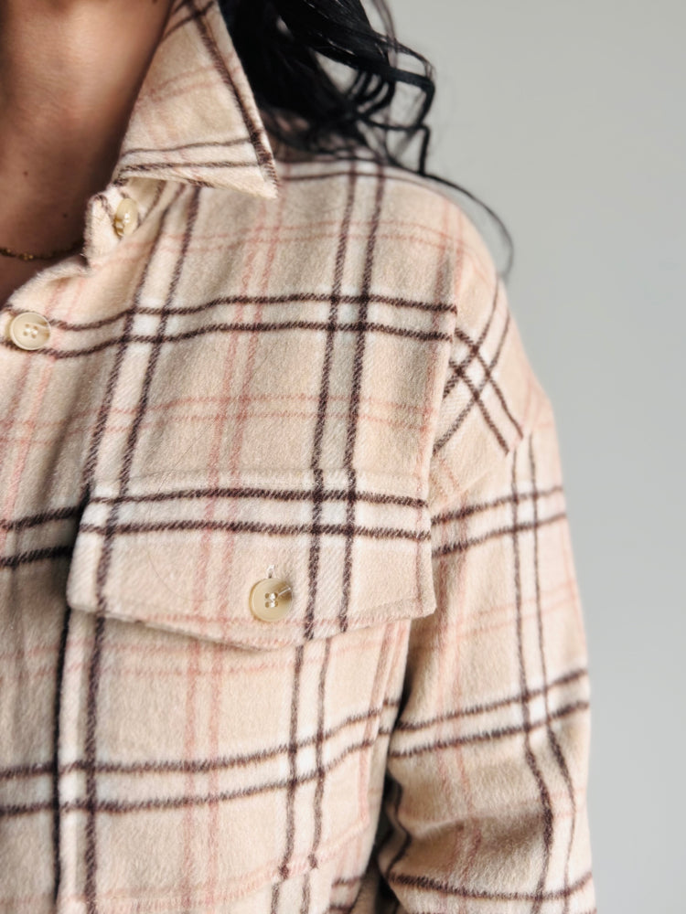 Close-up of plaid pattern and button cuff detail on Lainey shacket