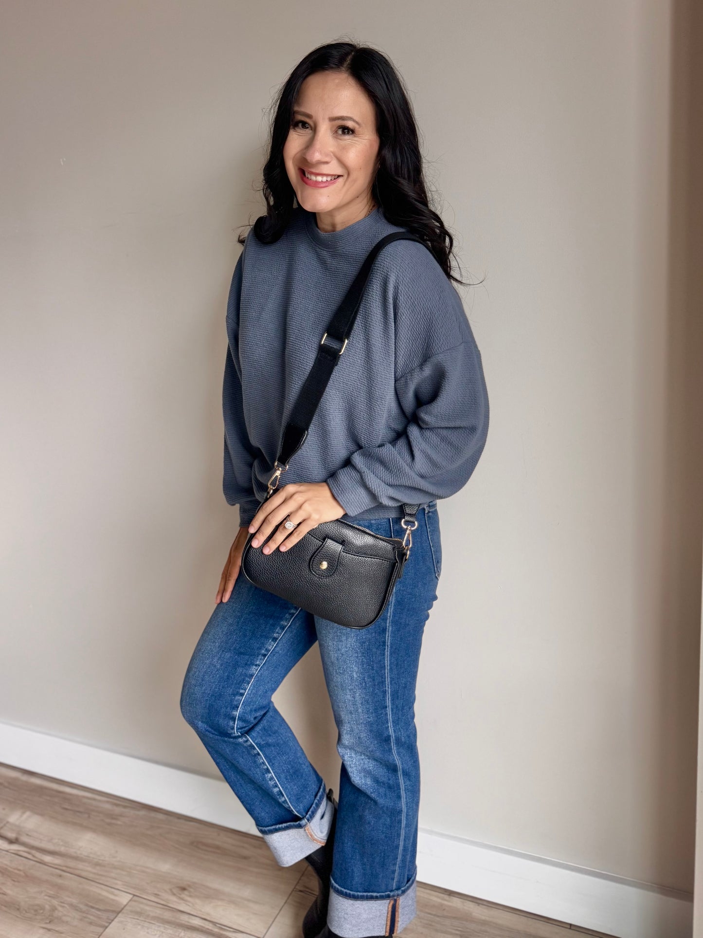 Side angle of Laurel top showing curved hem, side slit, and lightweight knit texture