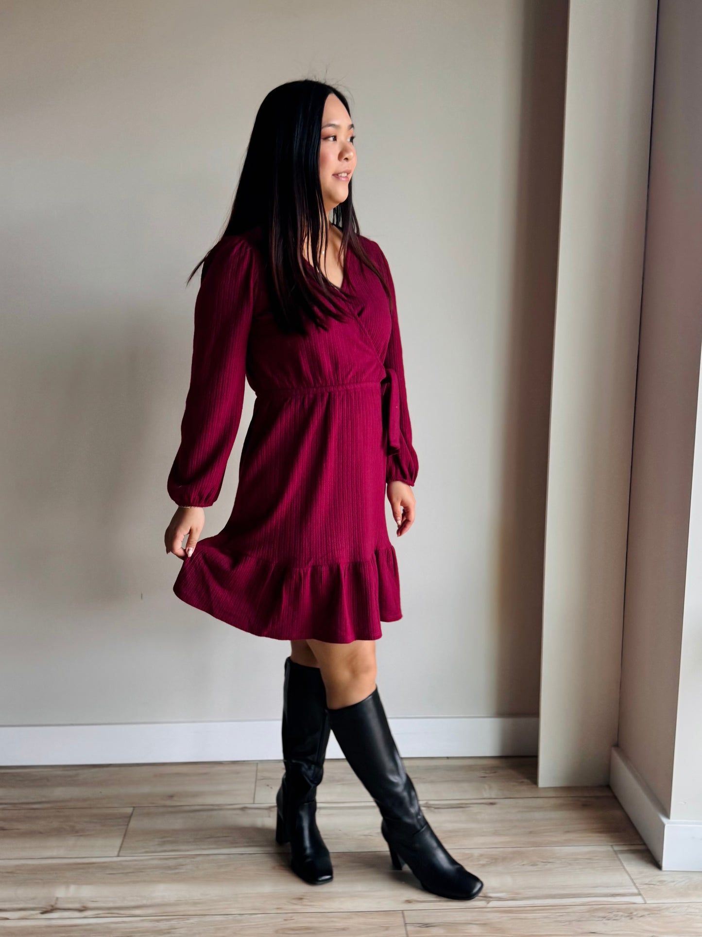 Close-up of Lively surplice dress long sleeves showing elegant coverage and smooth drape