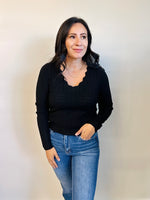 Lottie Scallop Trim V-Neck Top in Black — front view showcasing scalloped neckline