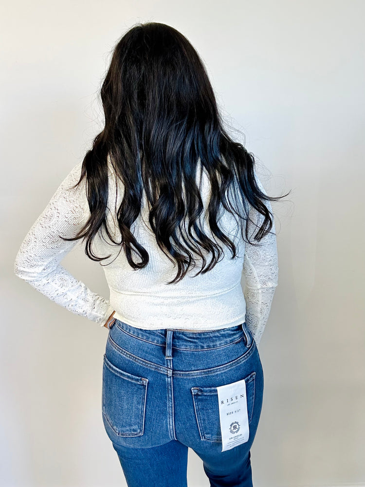 Back view of Mara embroidered lace top in ivory, highlighting the lace pattern and long sleeves
