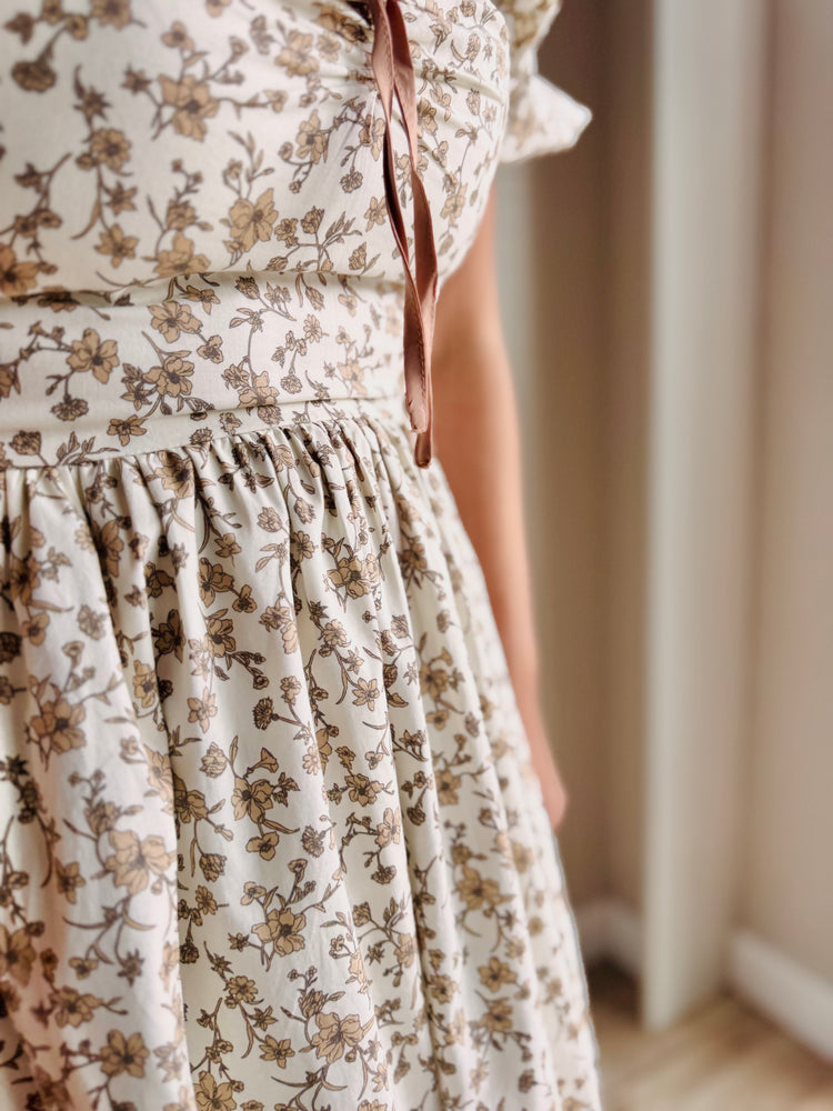 Close-up of soft cotton fabric and floral pattern on Maribel midi dress