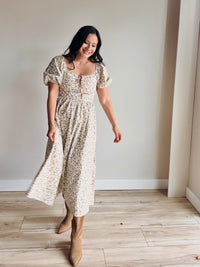 Front view of Maribel floral midi dress with puff sleeves and ruched bust in soft cotton