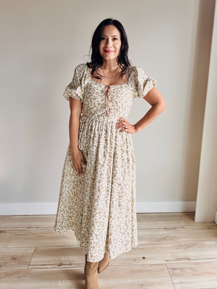 Full-length view of Maribel midi dress with floral print and side pockets