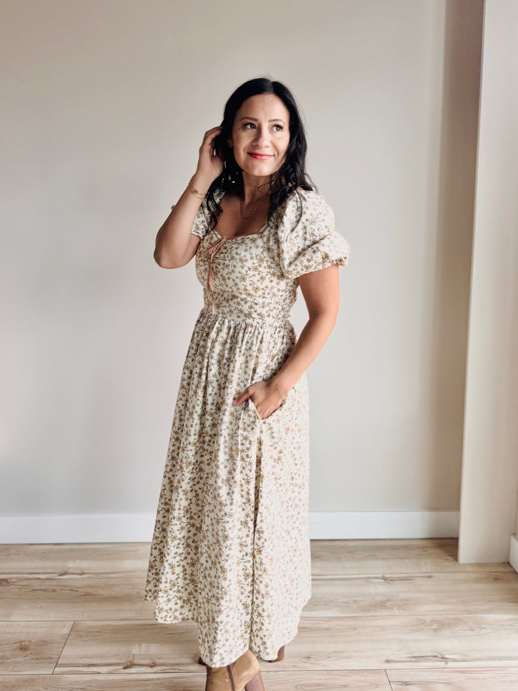 Side profile of floral midi dress showing smocked back and flattering silhouette