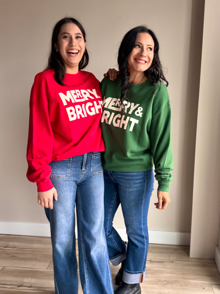 Folded view of red and white crewneck showing soft knit texture and festive print