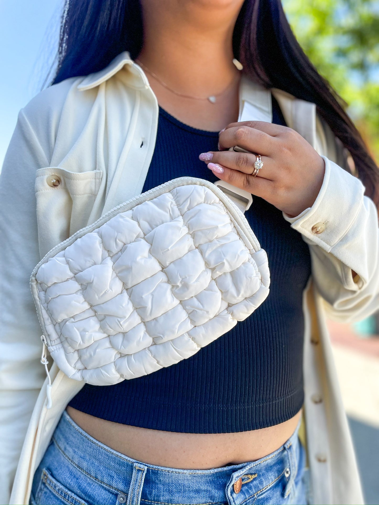 Front view of Quilted Belt Bag in Ivory, showcasing soft quilted texture and zip closure.