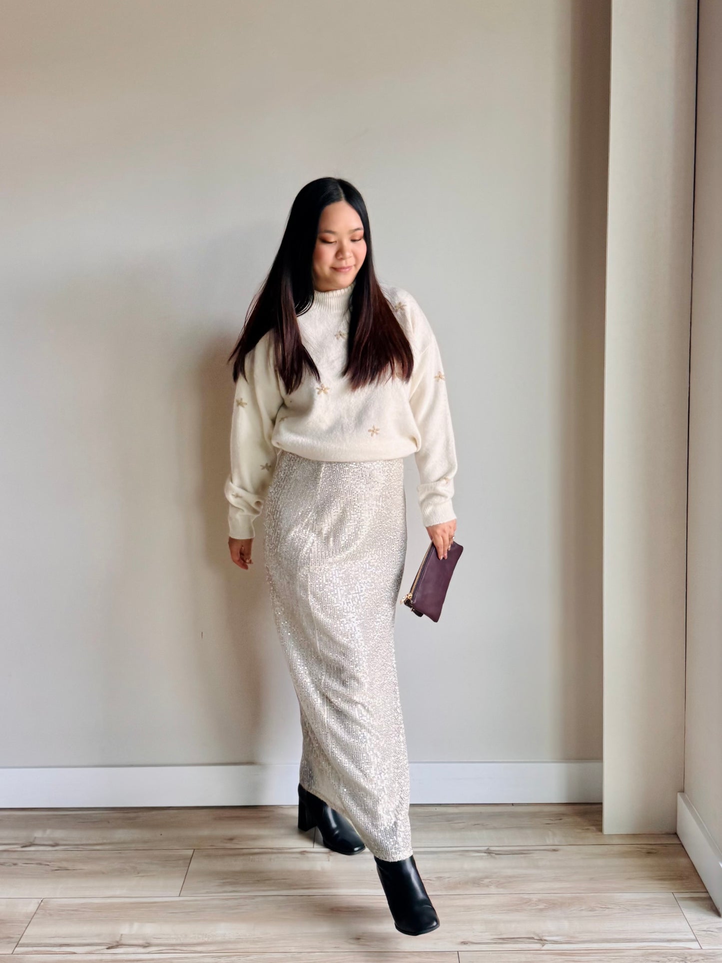 Styled pose wearing Rihanna sequin maxi skirt showcasing glamorous evening look and side slit movement