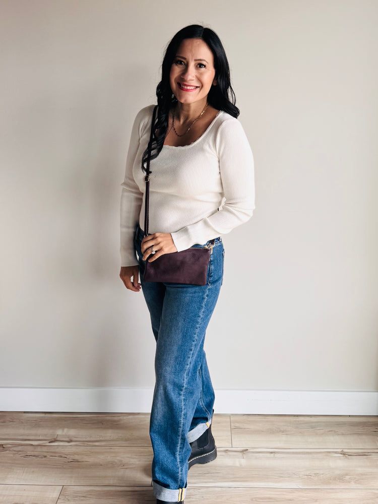 Front view of sangria Sedona purse with gold zipper and medallion emblem