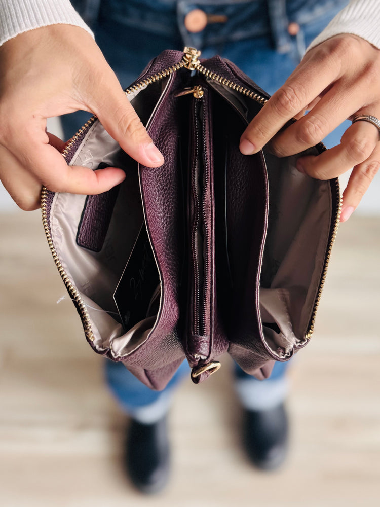 Open view of Sedona purse showing card slots, slip pockets, and center zipper compartment
